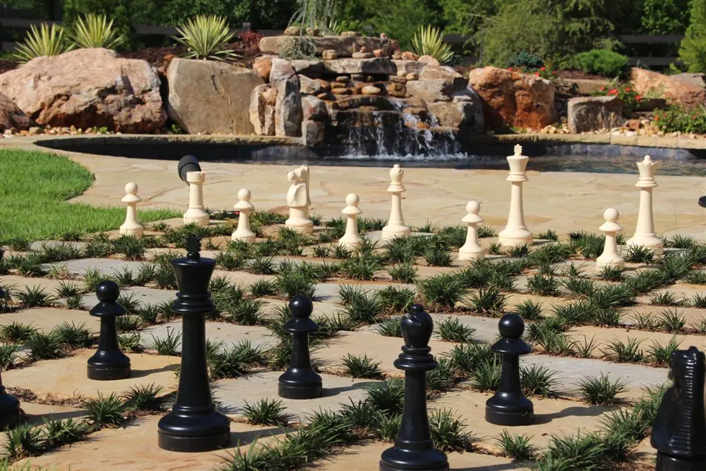 Chestnut Cream chess board patio and fieldstone boulder waterfall